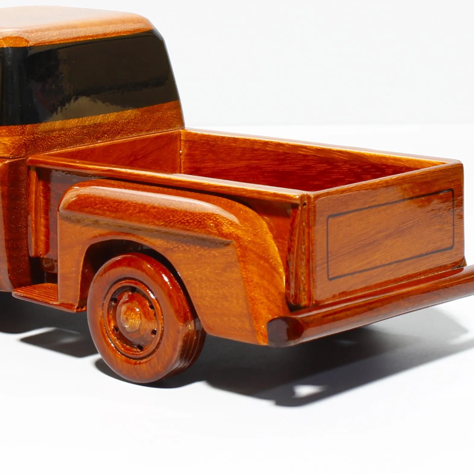 Detailed rear bed of 1957 Ford truck model – polished mahogany wood