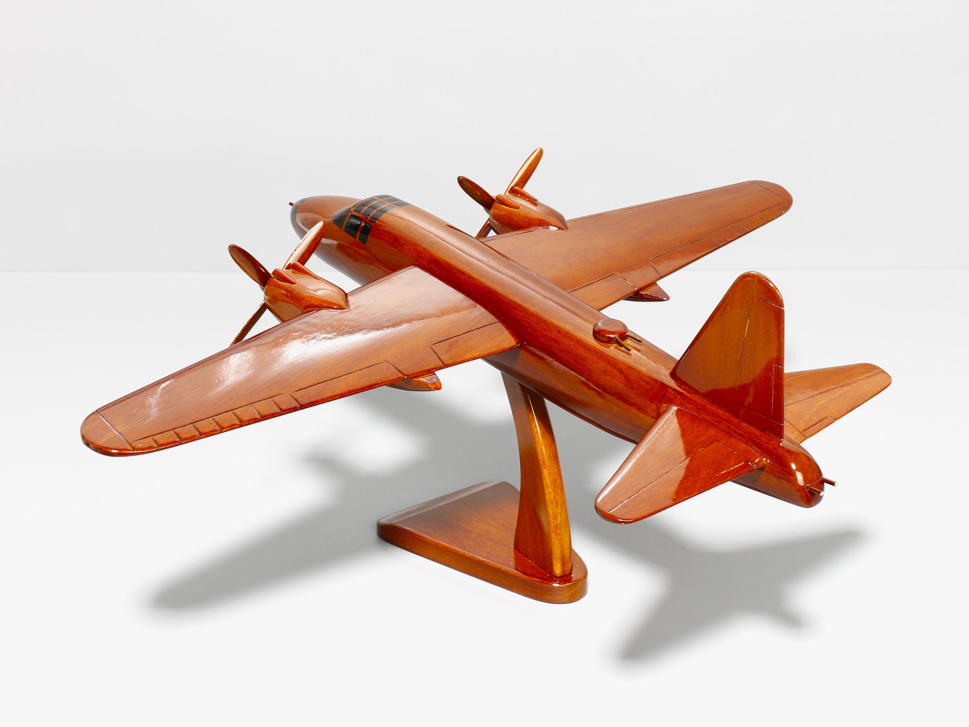 WWII B-26 bomber replica on wooden display stand