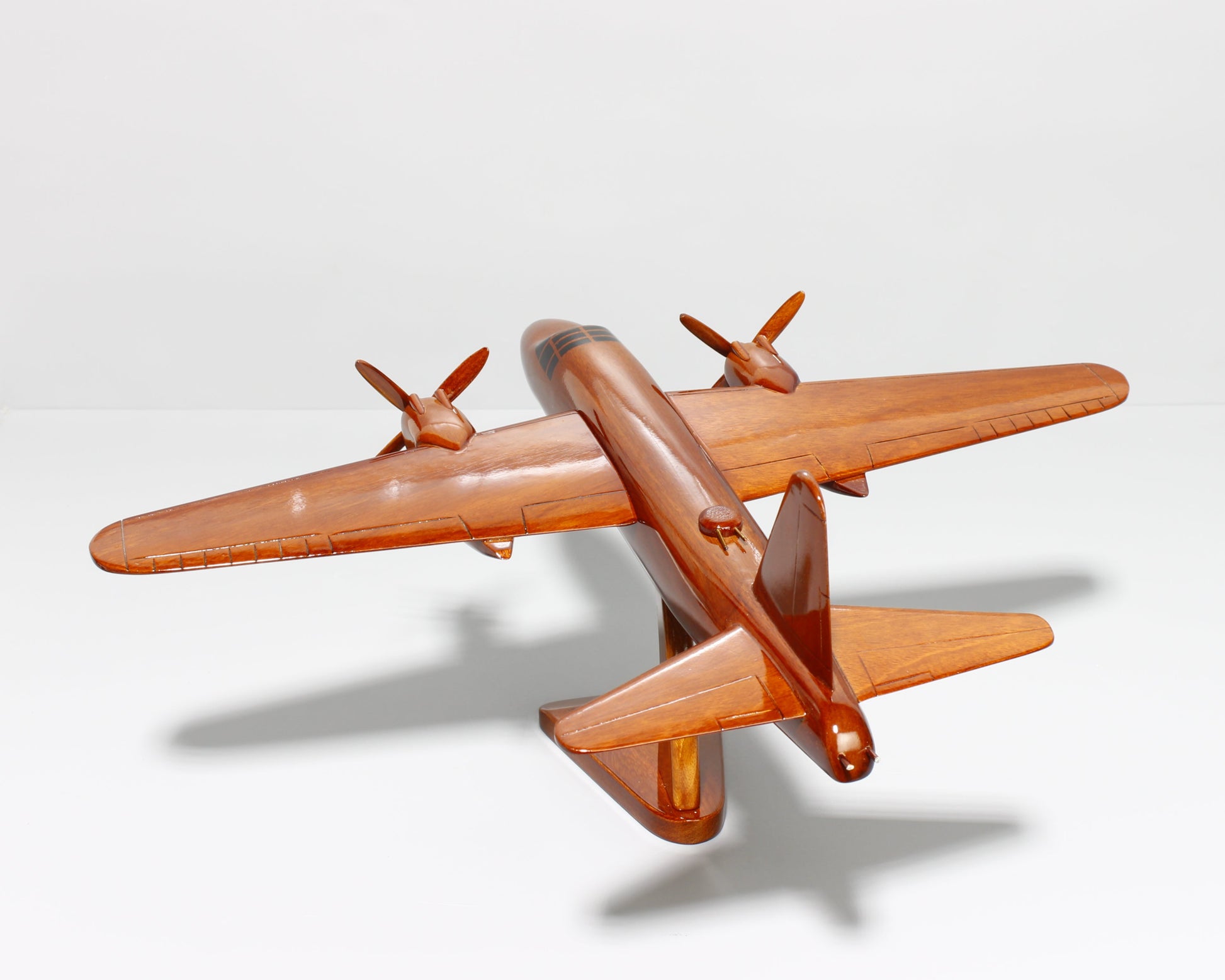 WWII B-26 bomber replica on wooden display stand