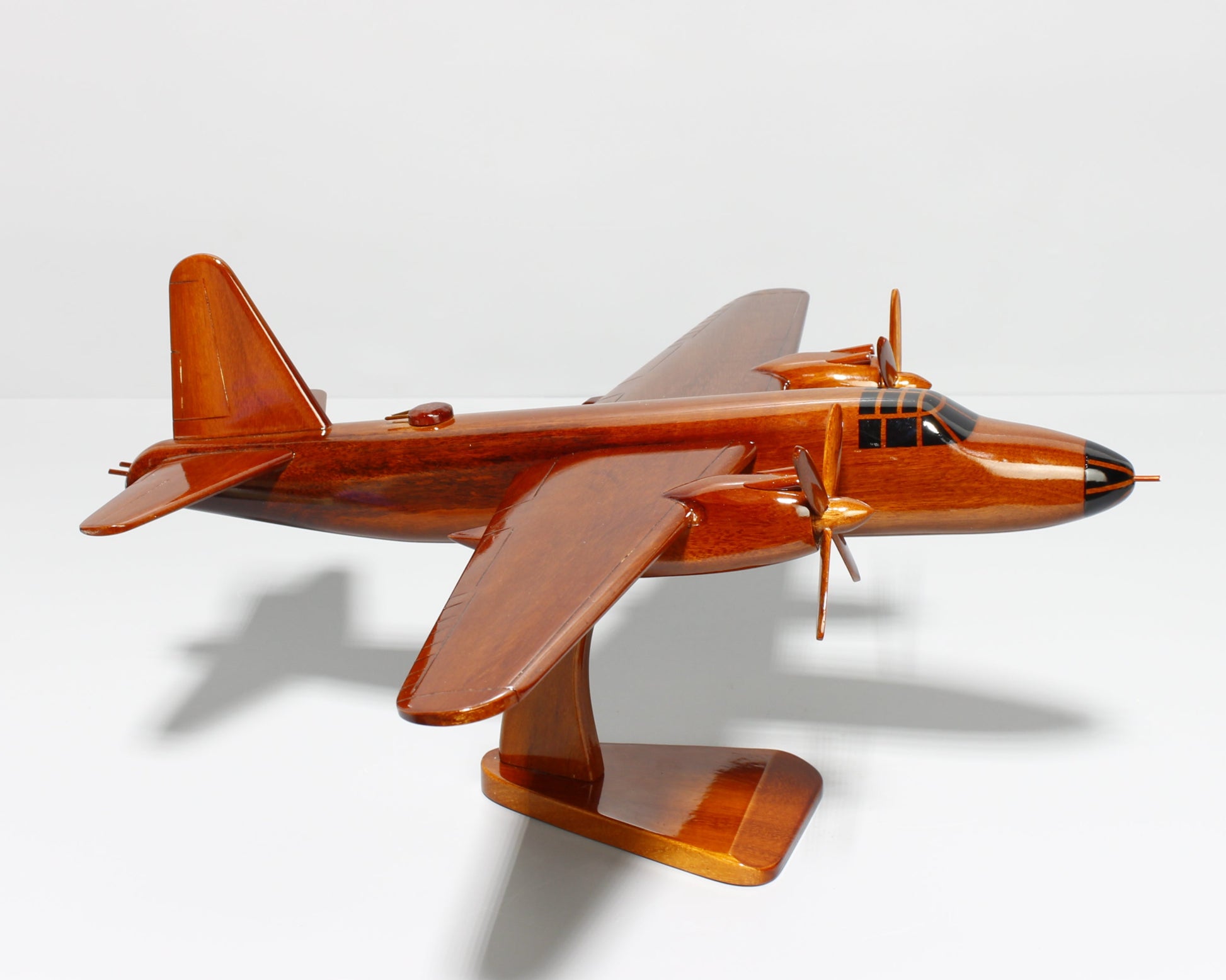 WWII B-26 bomber replica on wooden display stand