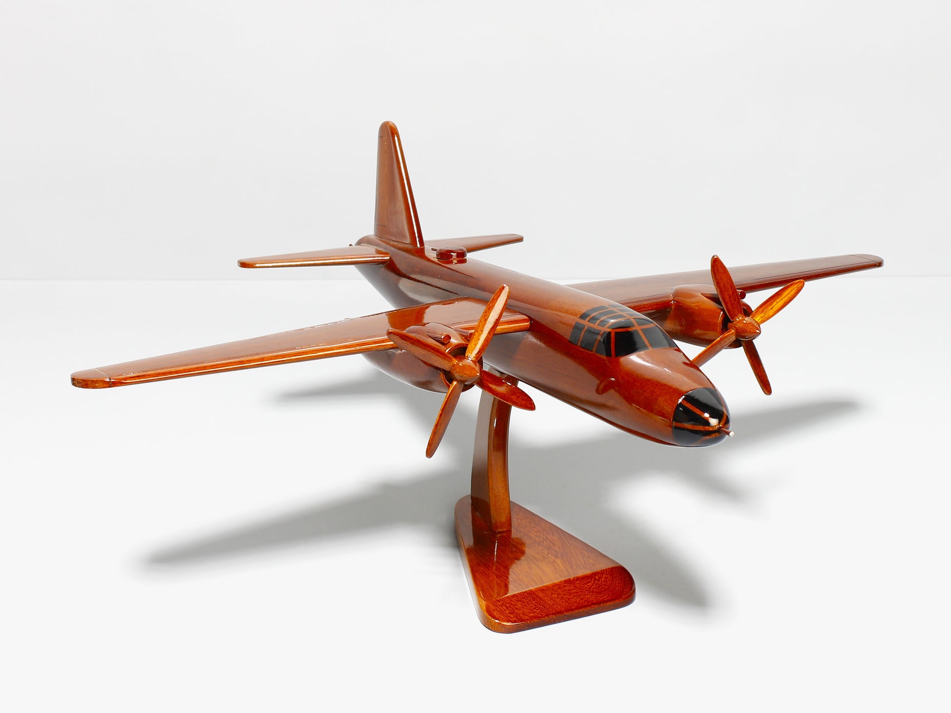 WWII B-26 bomber replica on wooden display stand