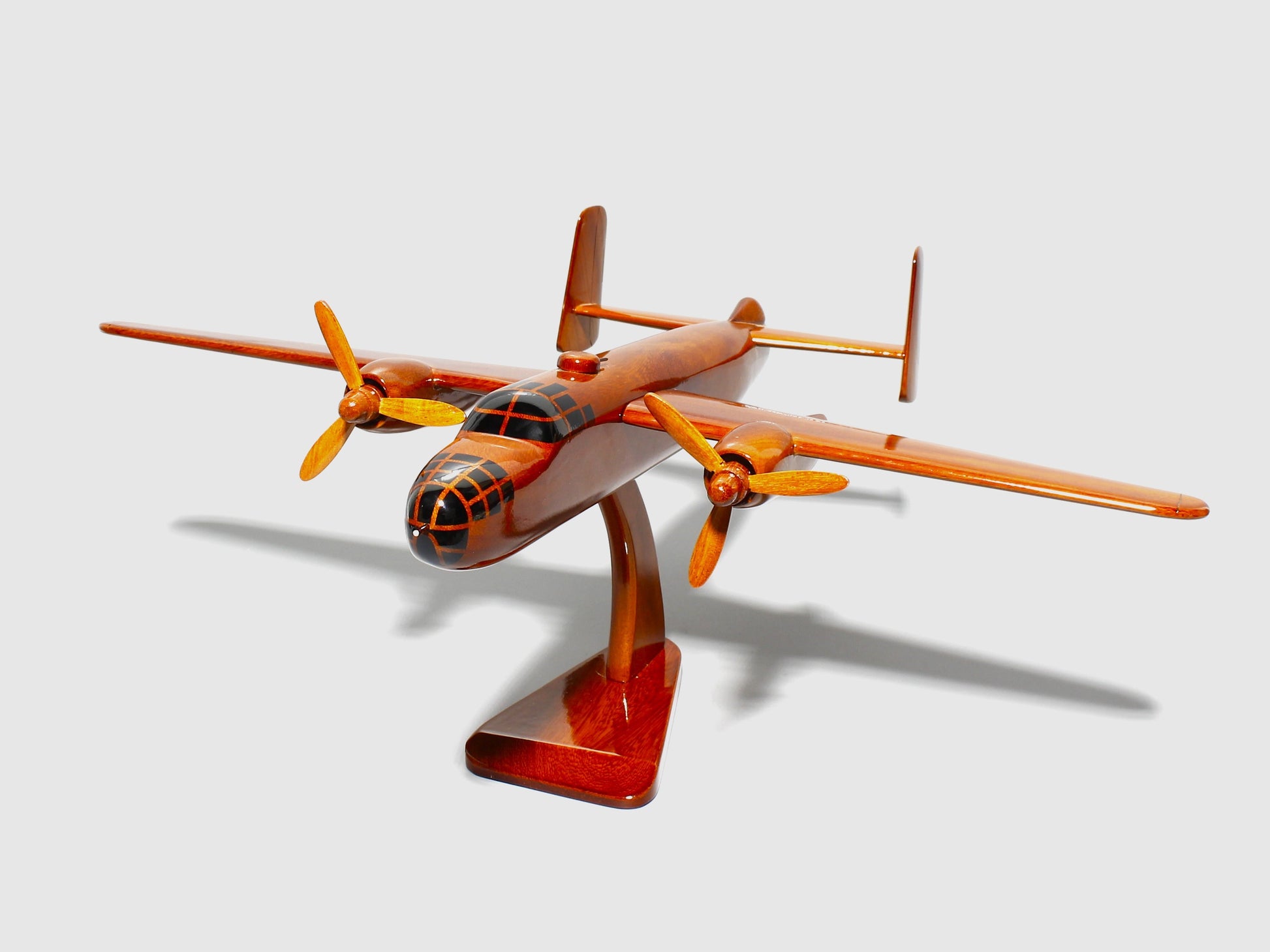 Handcrafted B-25 Mitchell wooden model airplane on mahogany stand