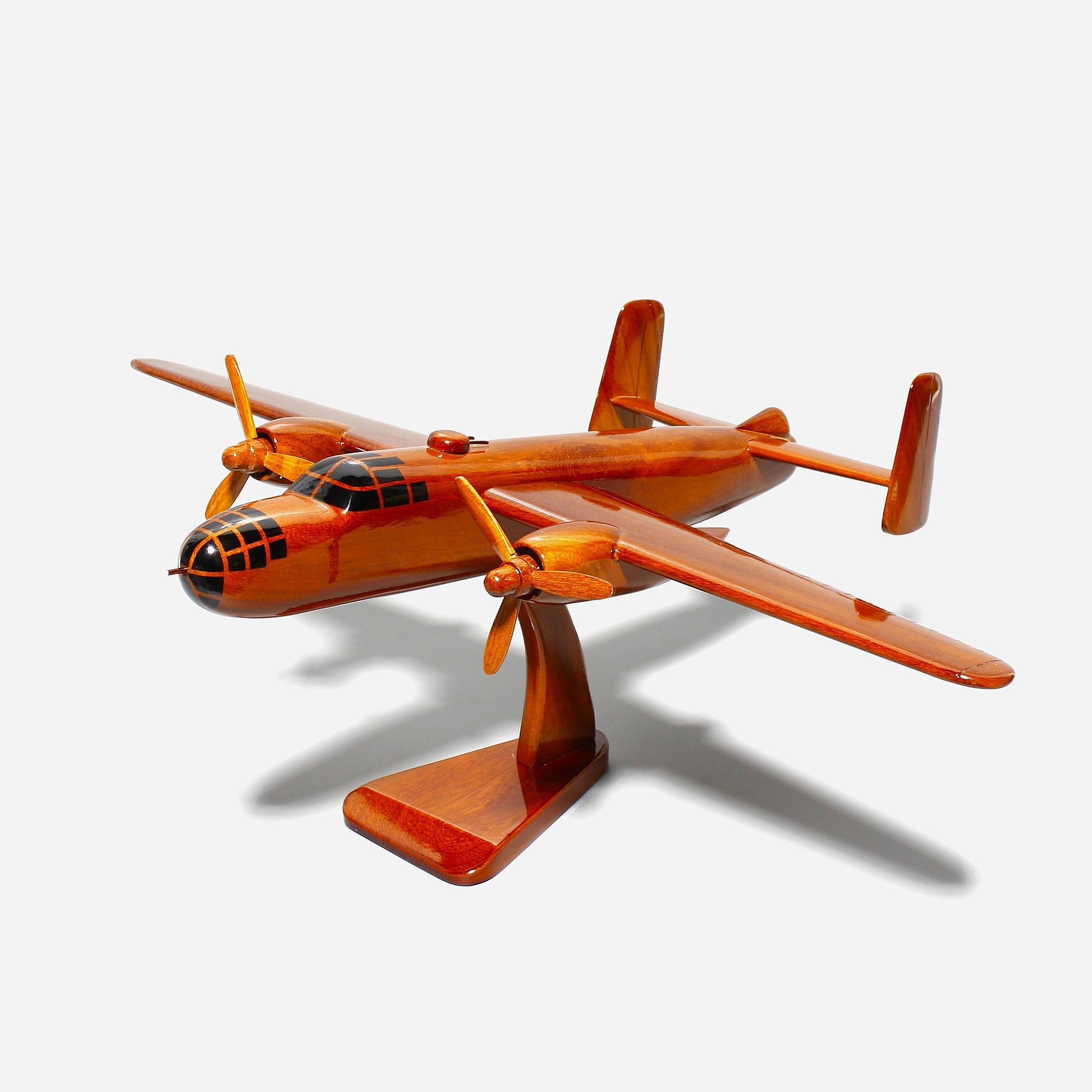 Handcrafted B-25 Mitchell wooden model airplane on mahogany stand