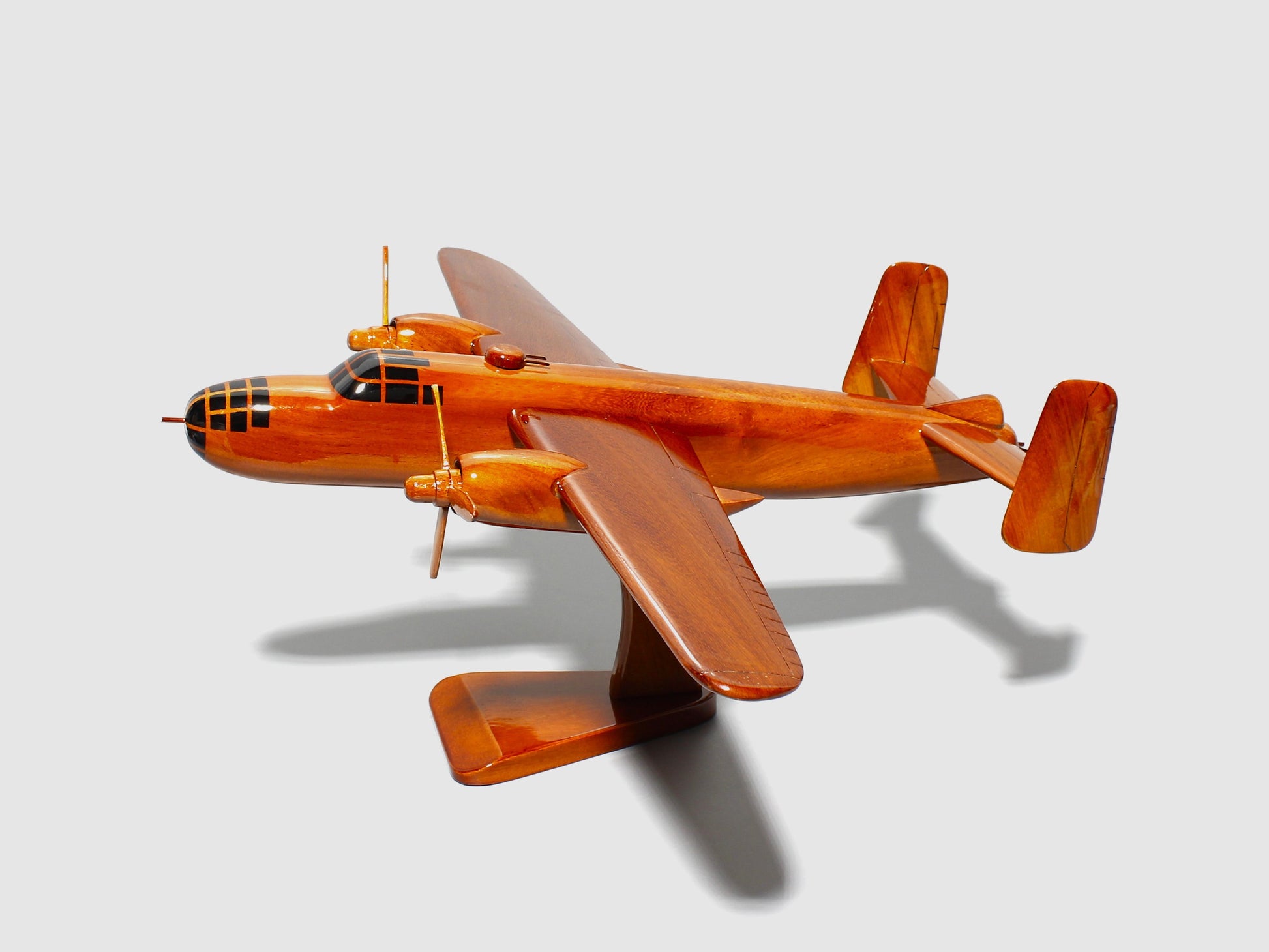 Polished WWII B-25 bomber wood replica with twin tail