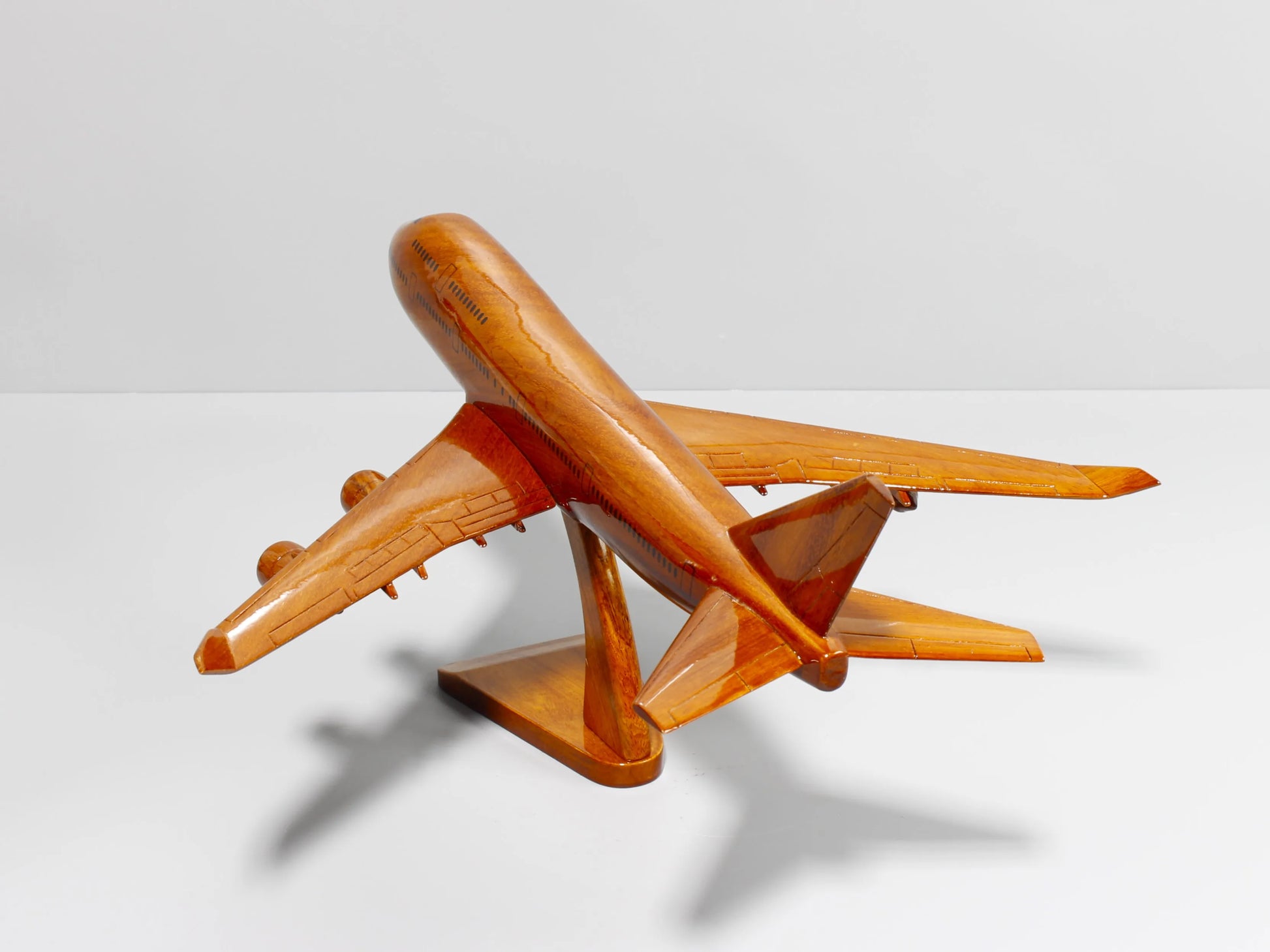Boeing 747 model plane in flight pose – artisan-crafted mahogany replica