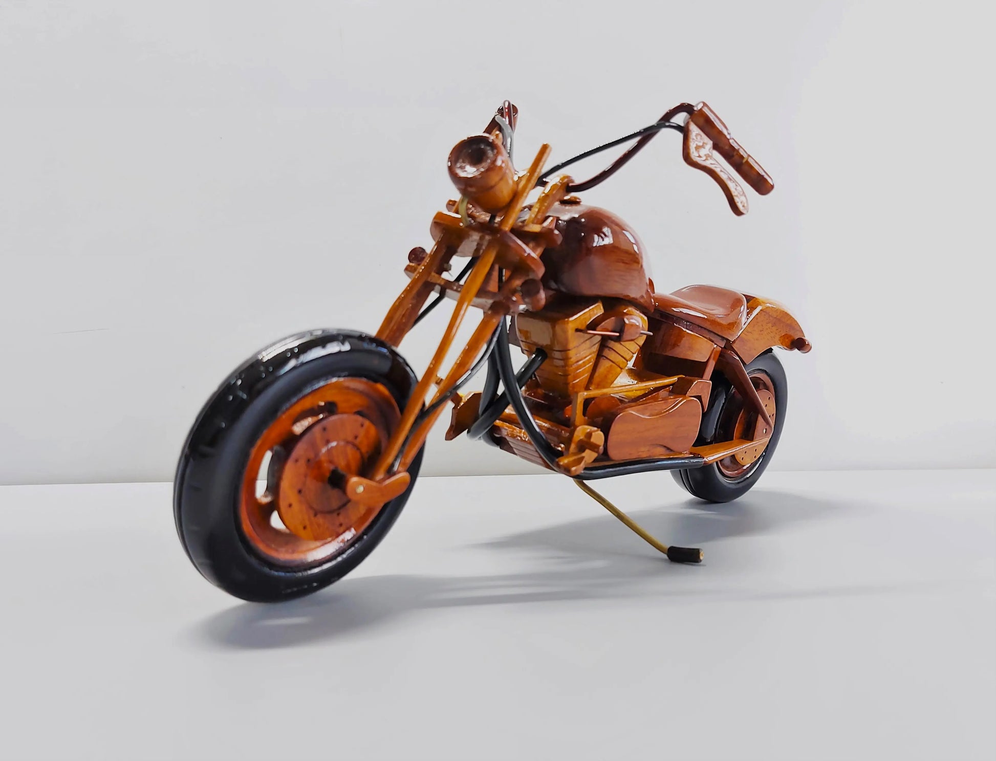 Wooden chopper motorcycle – left front angle with long front fork