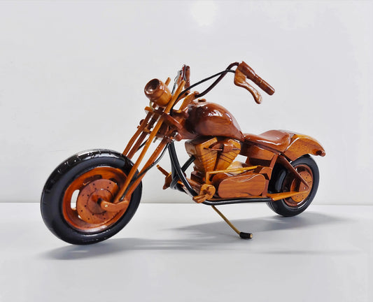 Handcrafted chopper wood model – front left angle showing handlebars and tank
