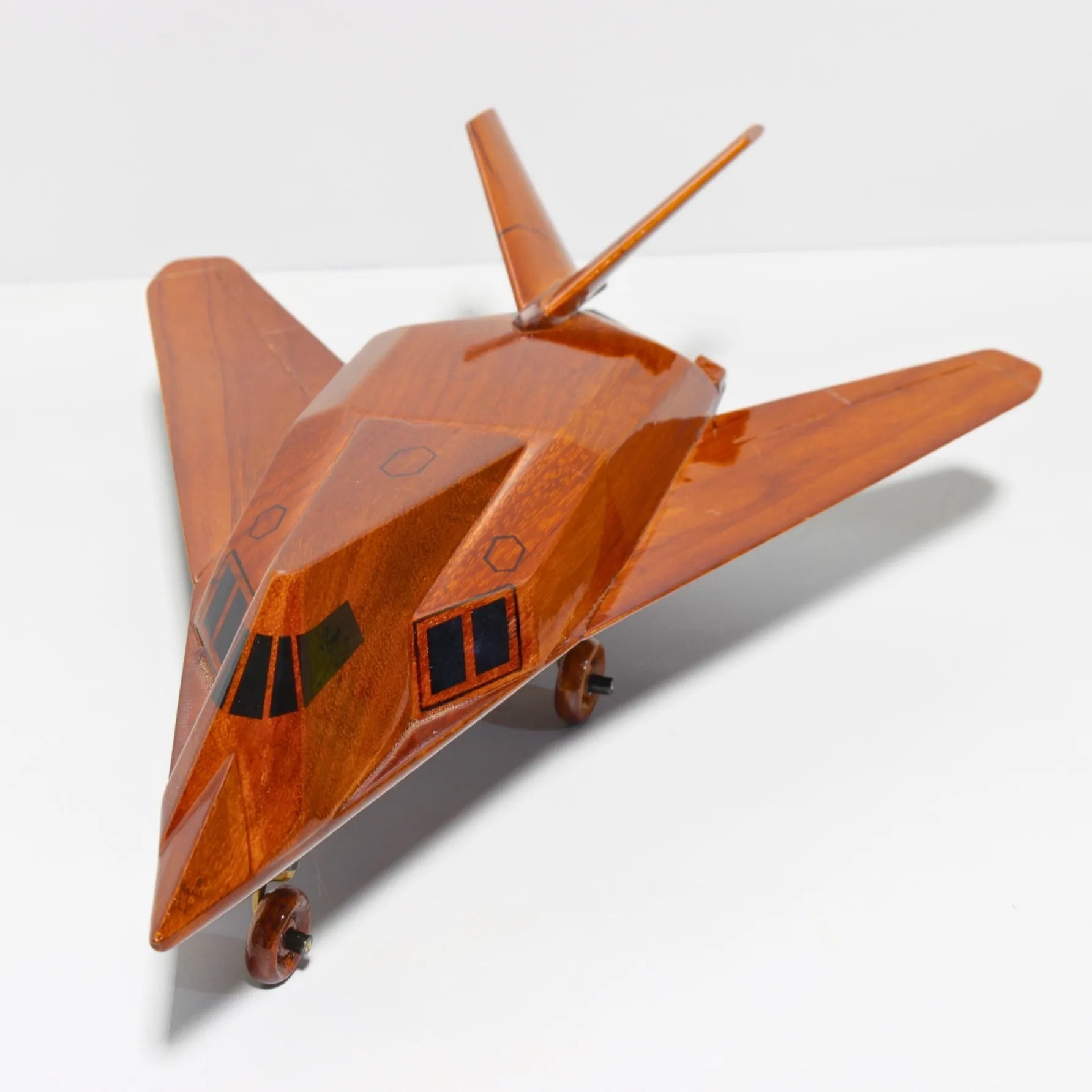 Top rear angle of F-117 Nighthawk handcrafted wooden plane
