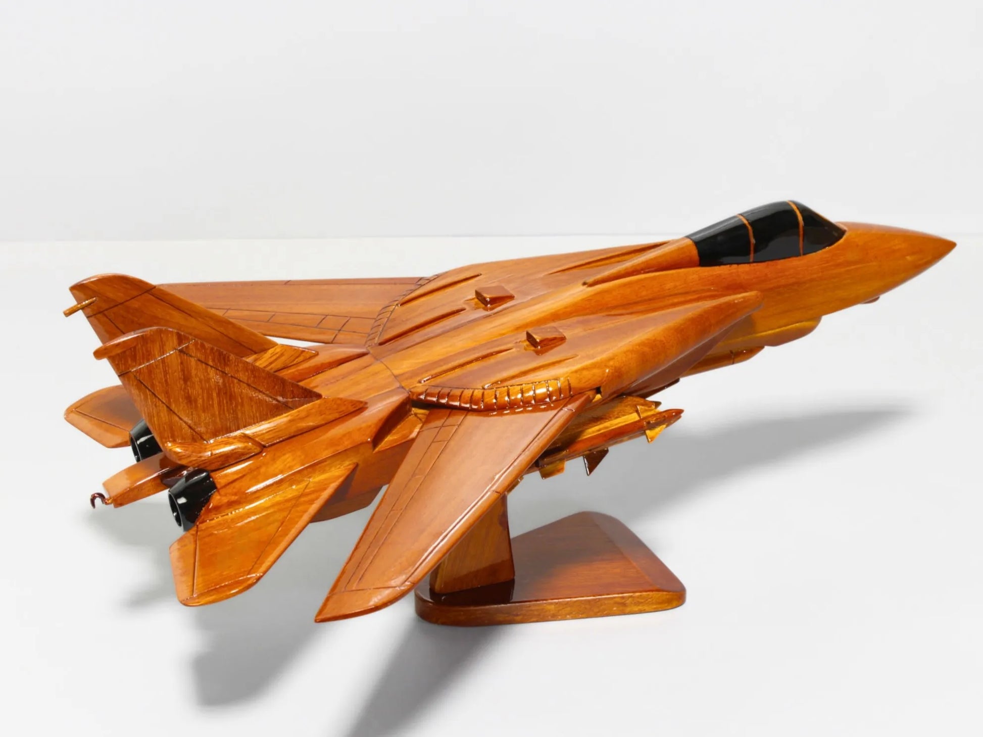 Side profile of handcrafted F-14 Tomcat model jet with rich mahogany finish – Premiumwoodart