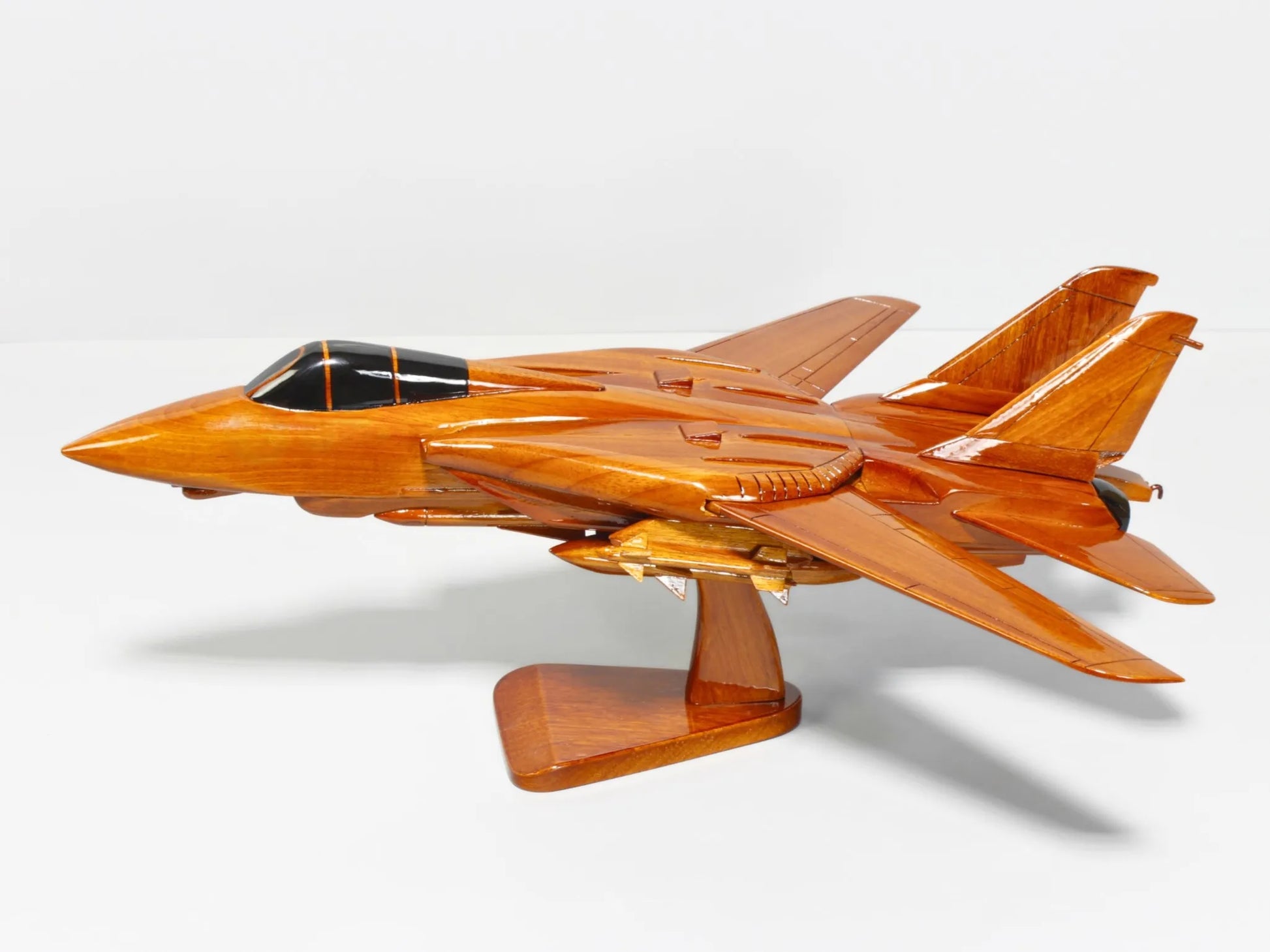 Front-left view of F-14 Tomcat naval wood model with sleek fighter jet shape