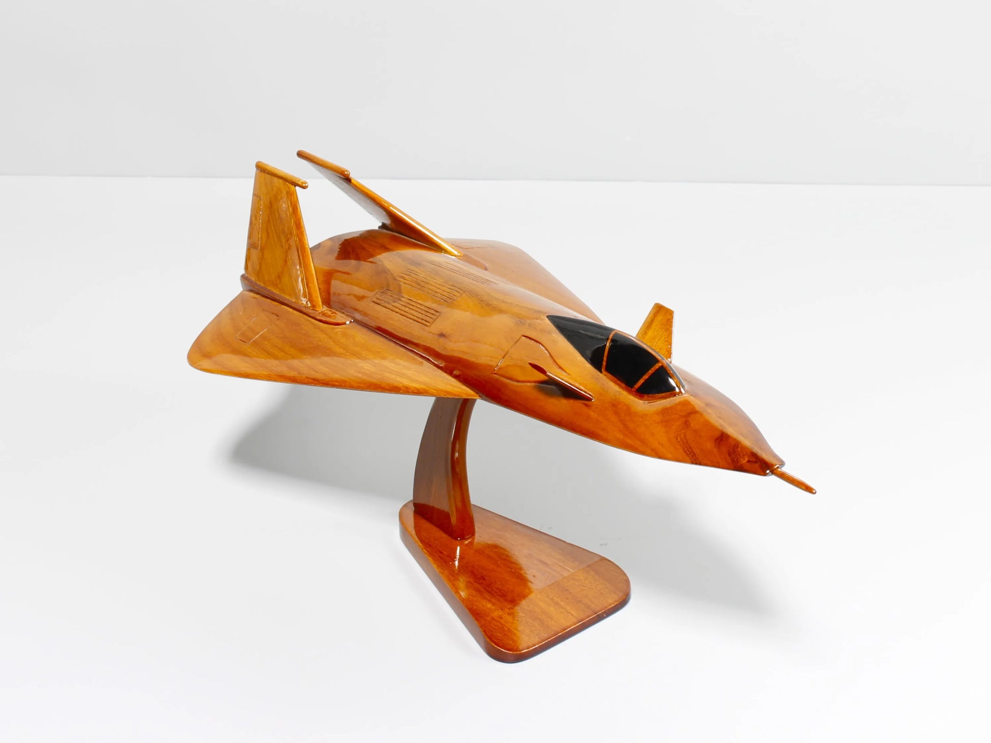 Angled display view of handcrafted F-19 stealth jet wood model on stand – Premiumwoodart