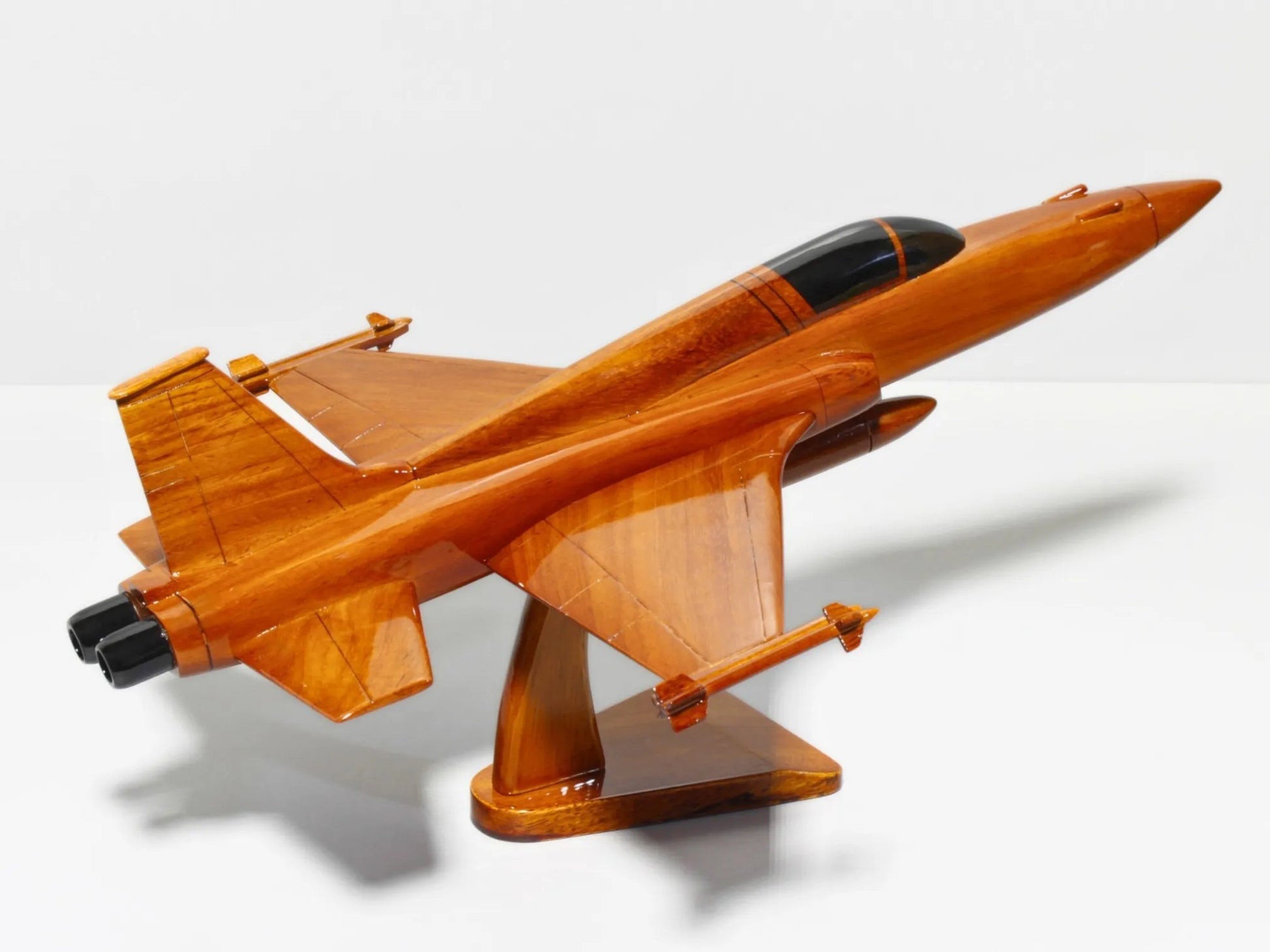 Side view of F-5 Tiger II wood model fighter jet on mahogany base – Premiumwoodart