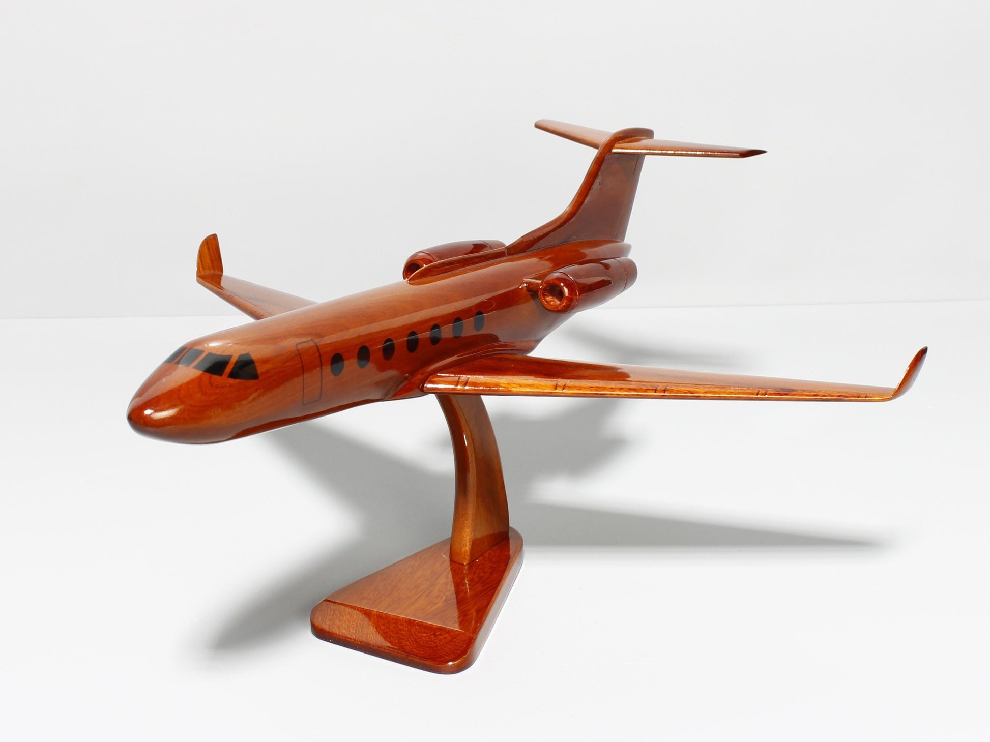 Rear view of handcrafted Gulfstream G550 wood airplane