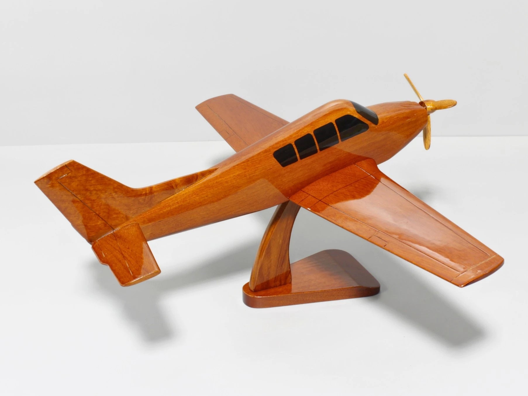 Elegant handcrafted Bonanza wooden aircraft model on wooden base – Premiumwoodart