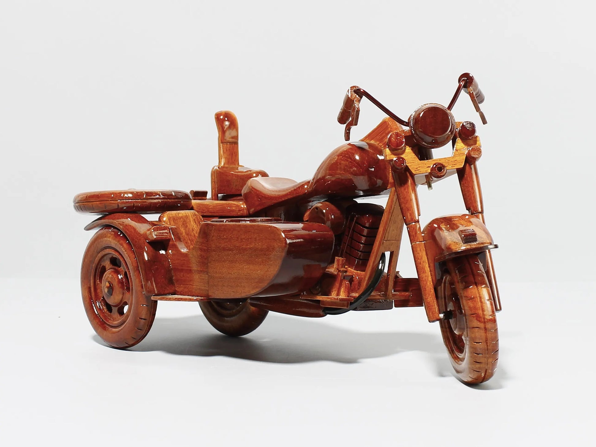 Closeup of sidecar attachment – wooden Harley motorcycle model with intricate detail