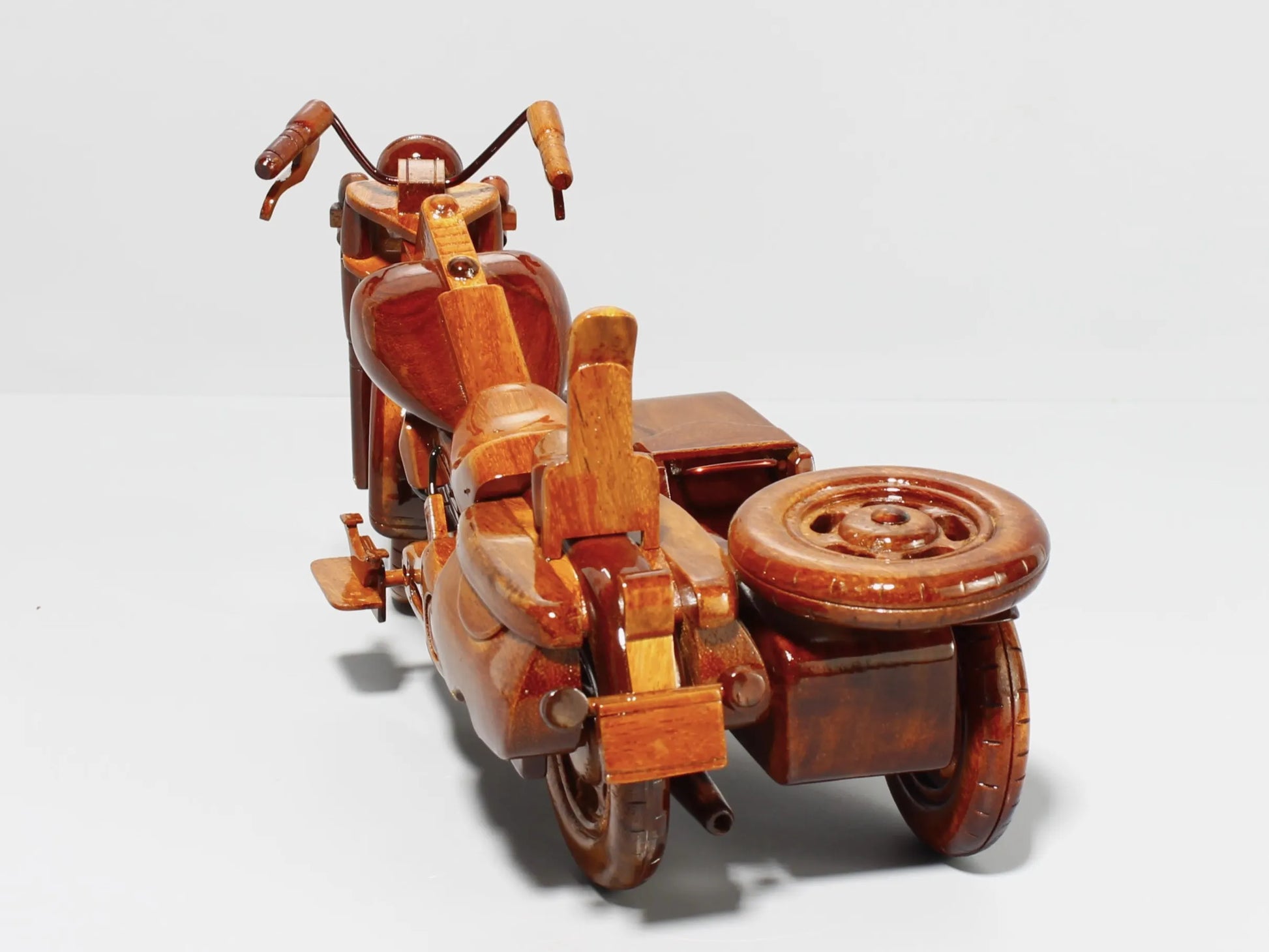 Rear view of Harley sidecar wooden model – detailed carving with spare tire