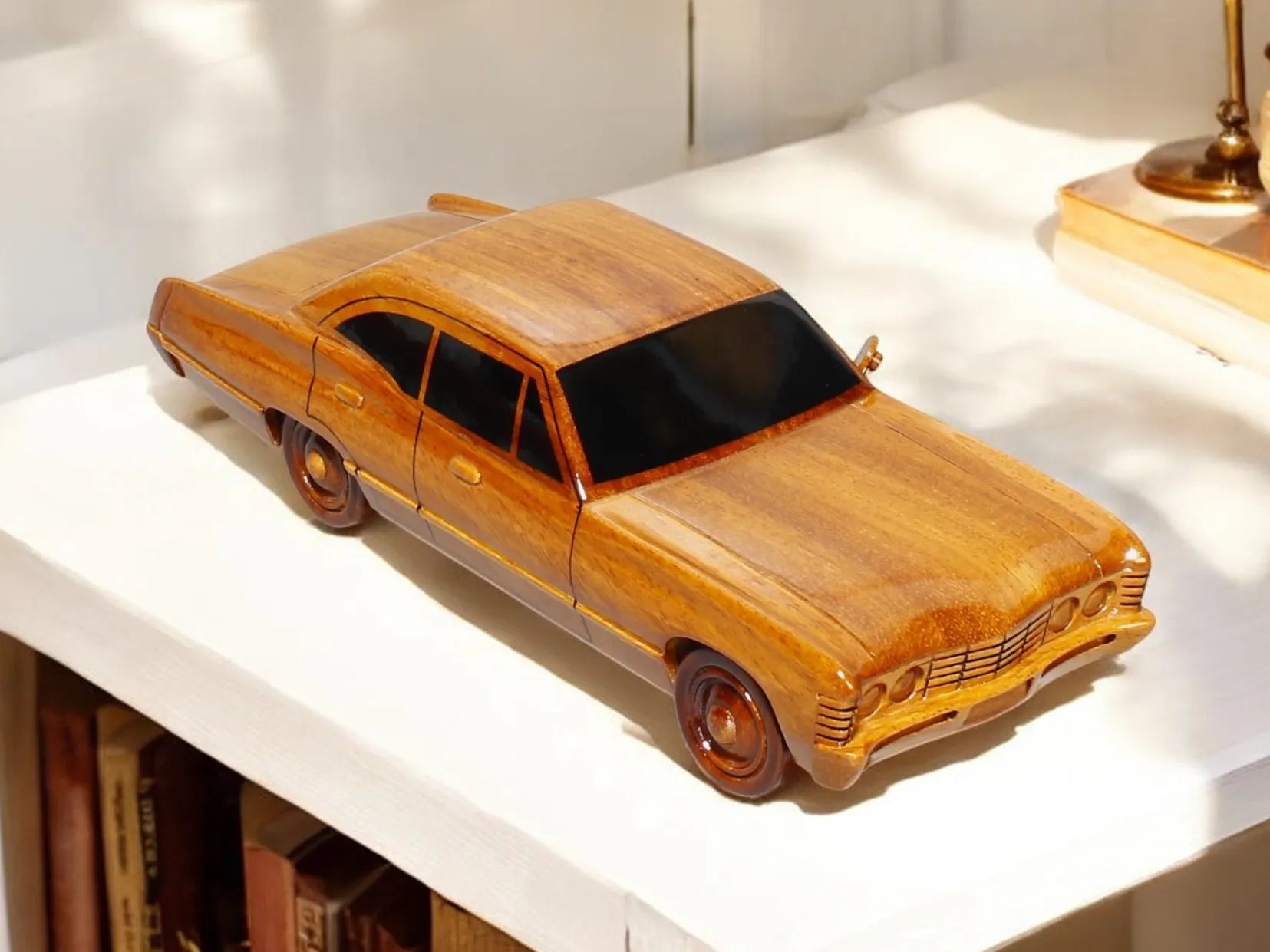 Chevy Impala wood model car – placed in cozy display shelf setting