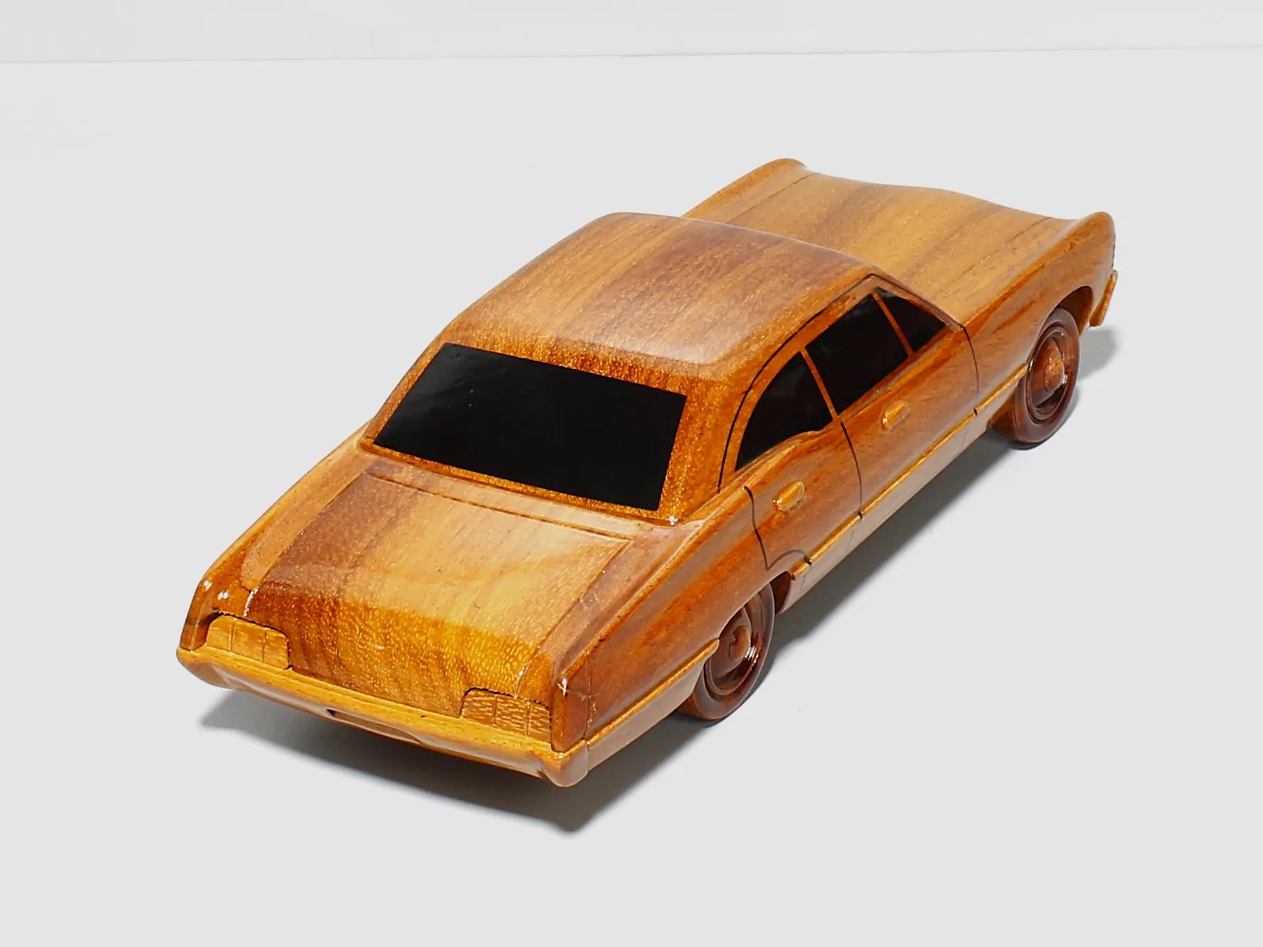 Vintage Impala wooden model – rear left showcasing taillight details
