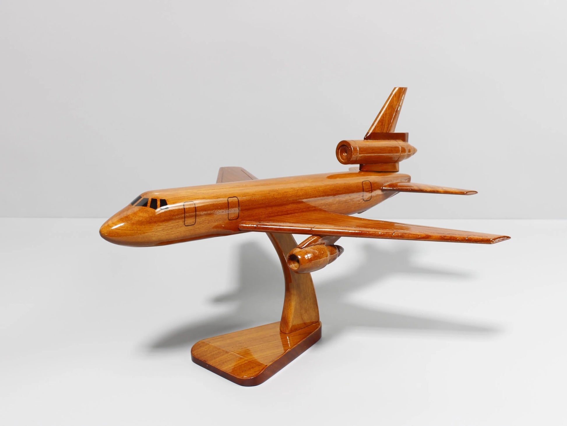 Side view of KC-10 wood model aircraft mounted on wooden stand – Premiumwoodart