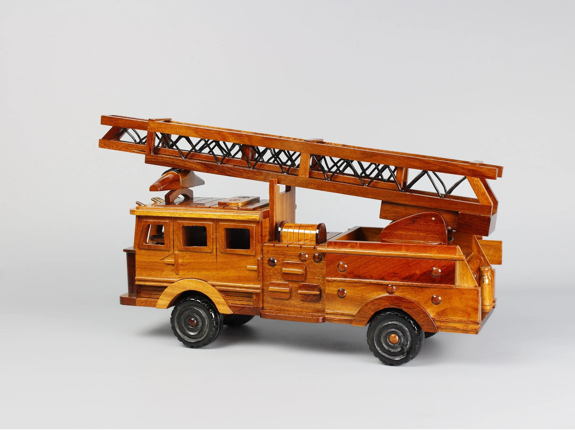 Wooden fire truck model – left side view with extended ladder