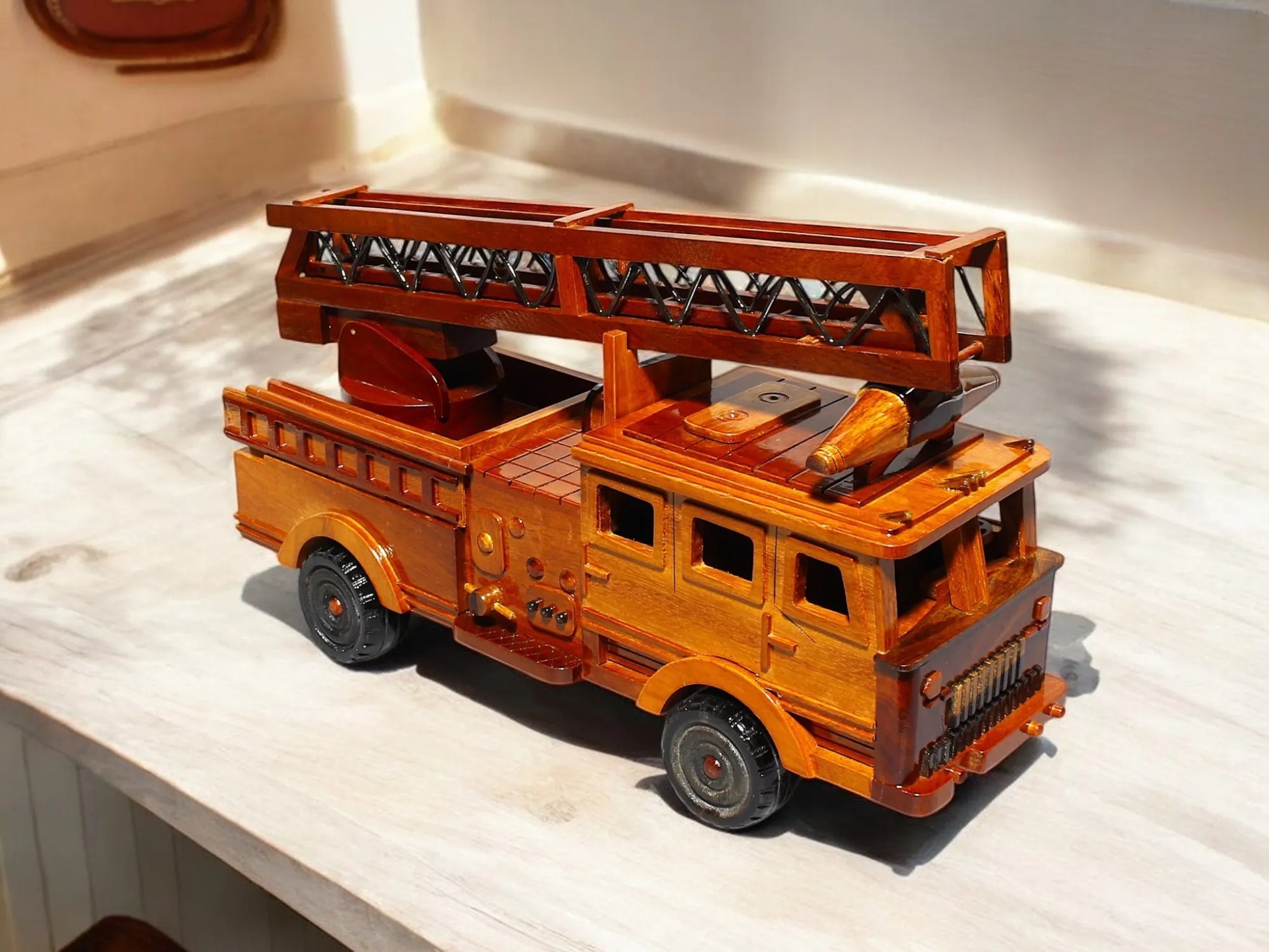 Display of ladder fire truck wood model – tabletop scene