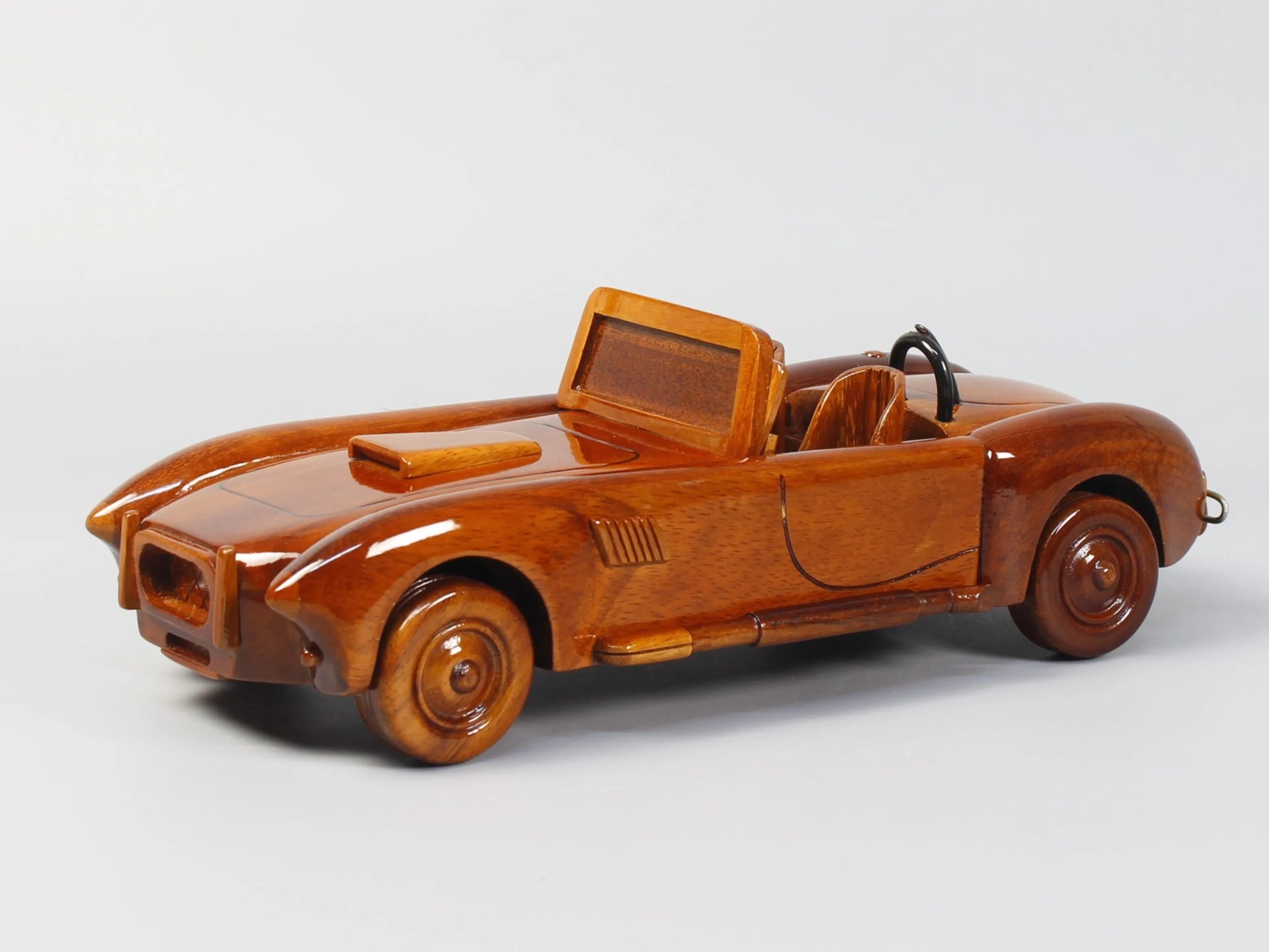 Diagonal front perspective of handcrafted Shelby Cobra model