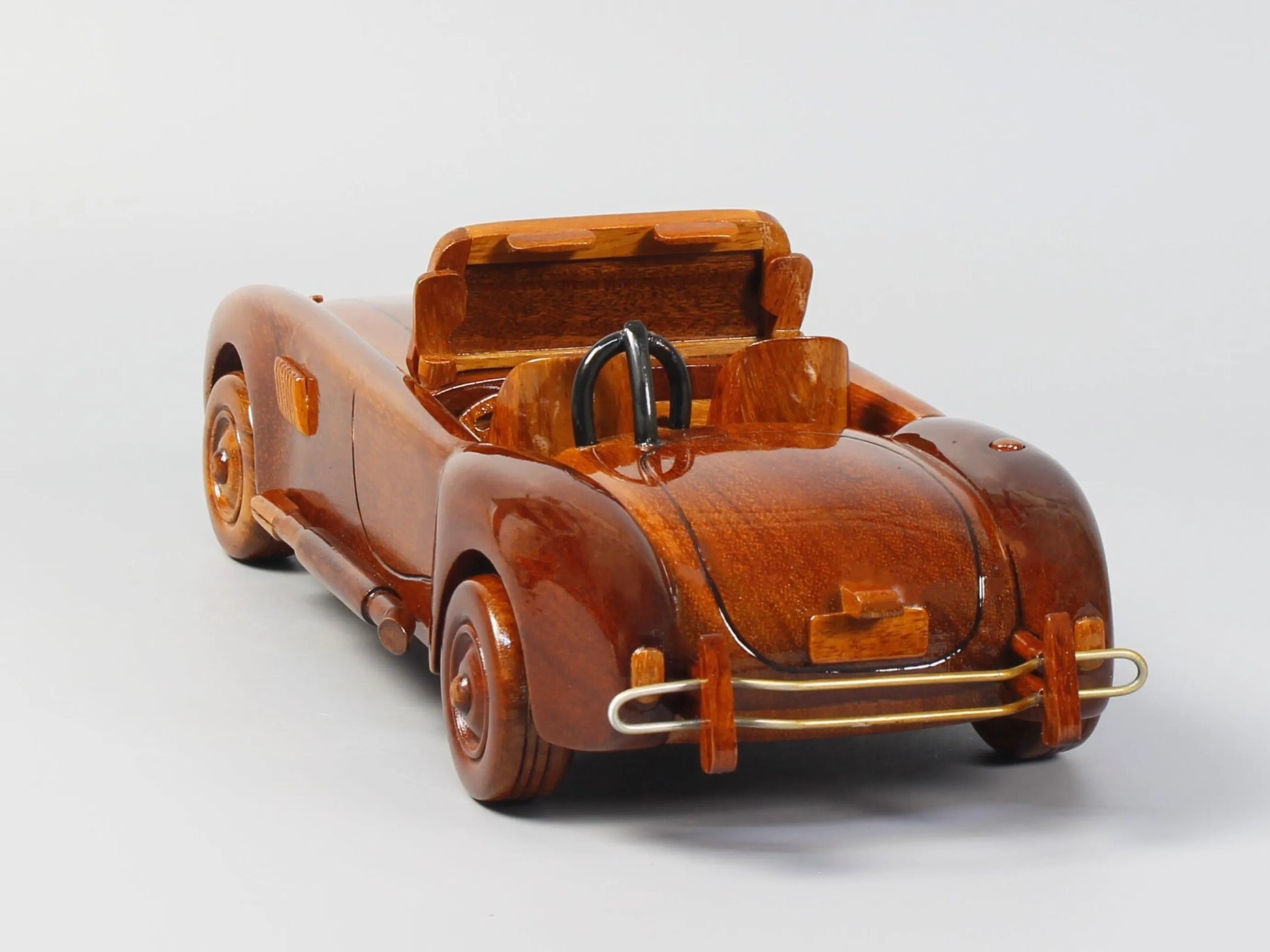 Rear angle of Shelby Cobra wood model showing tail details