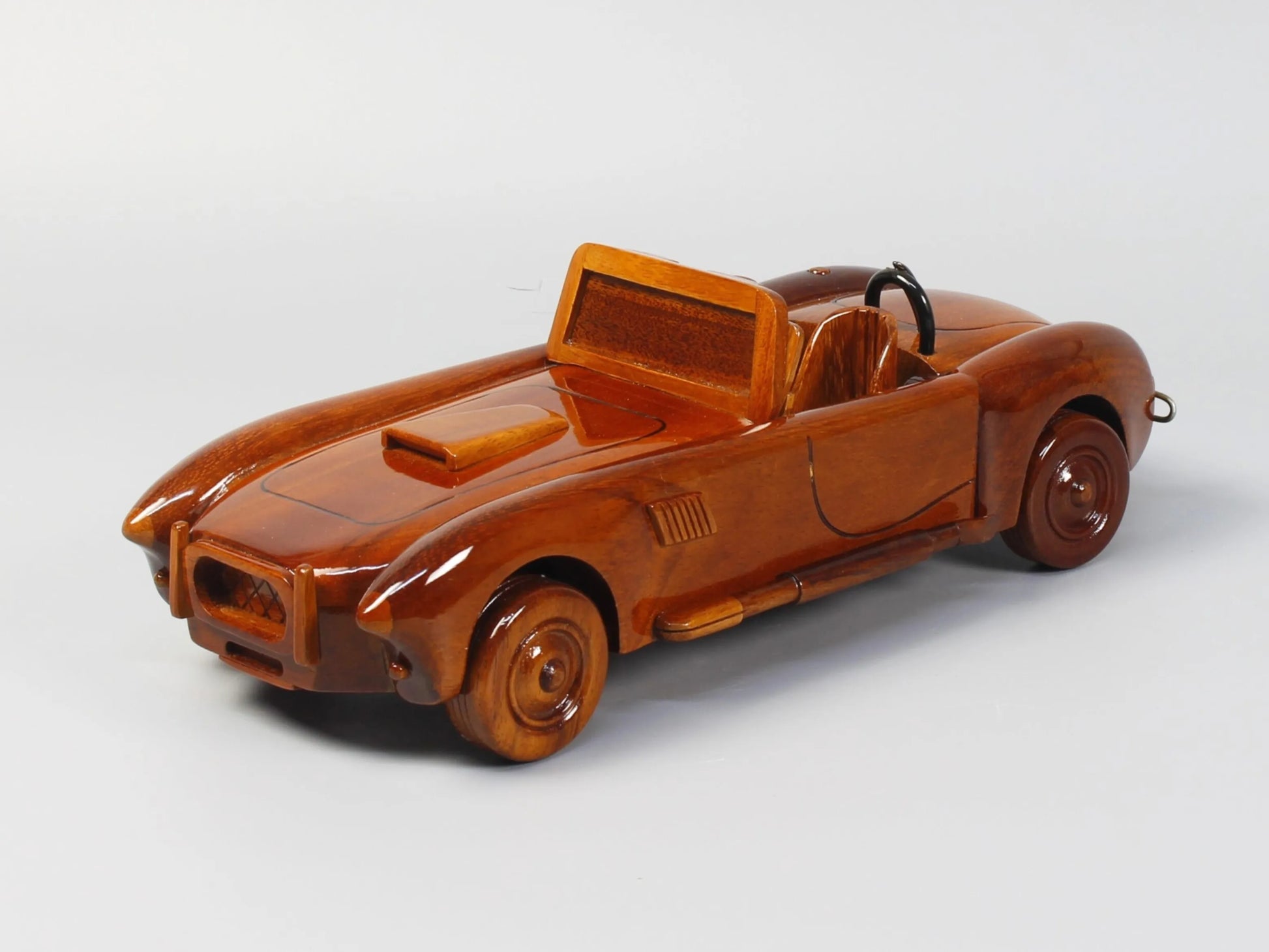 Left side profile of Shelby Cobra wooden car with open cockpit