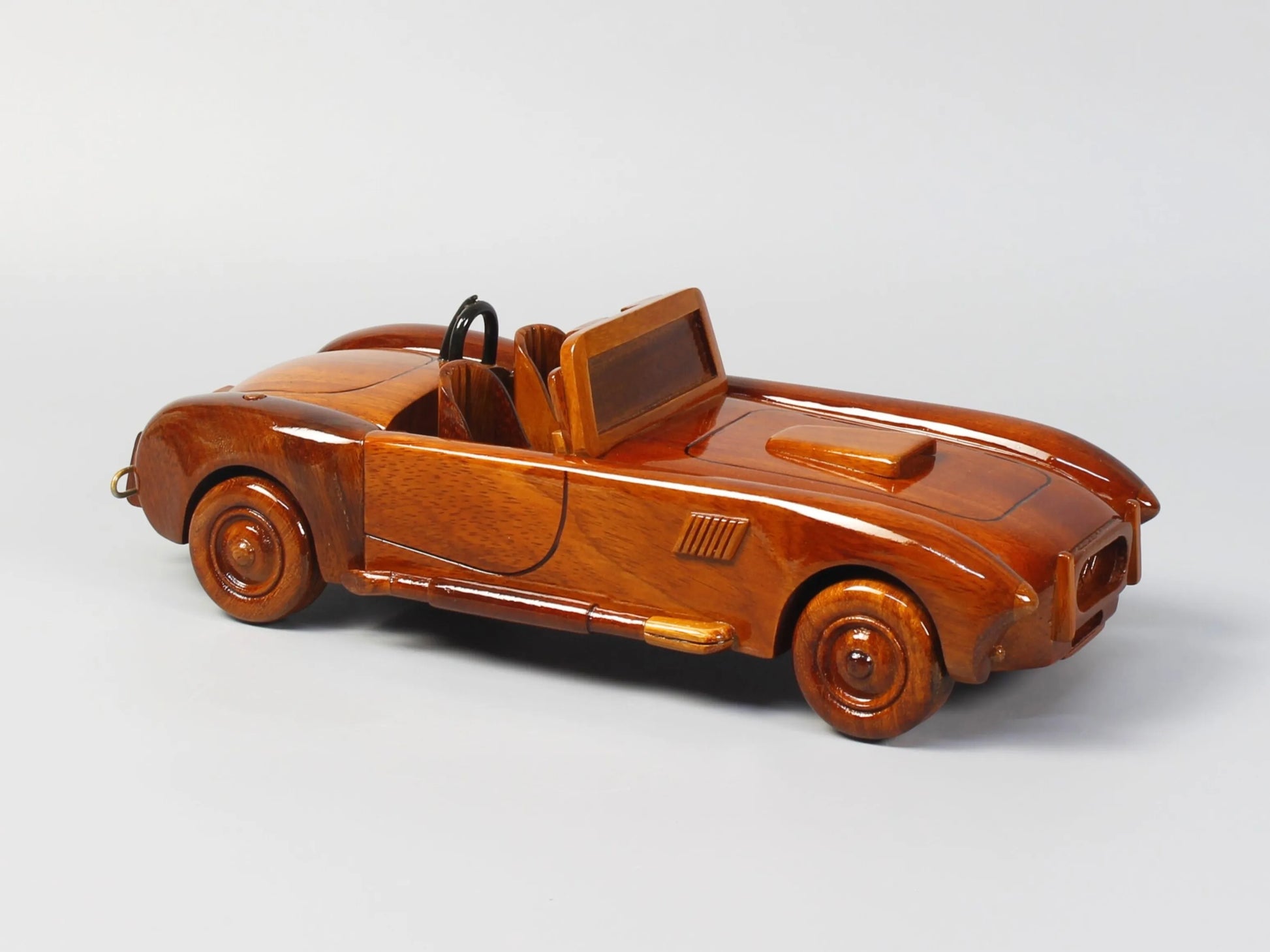 Right side of Shelby Cobra wood replica with vintage styling