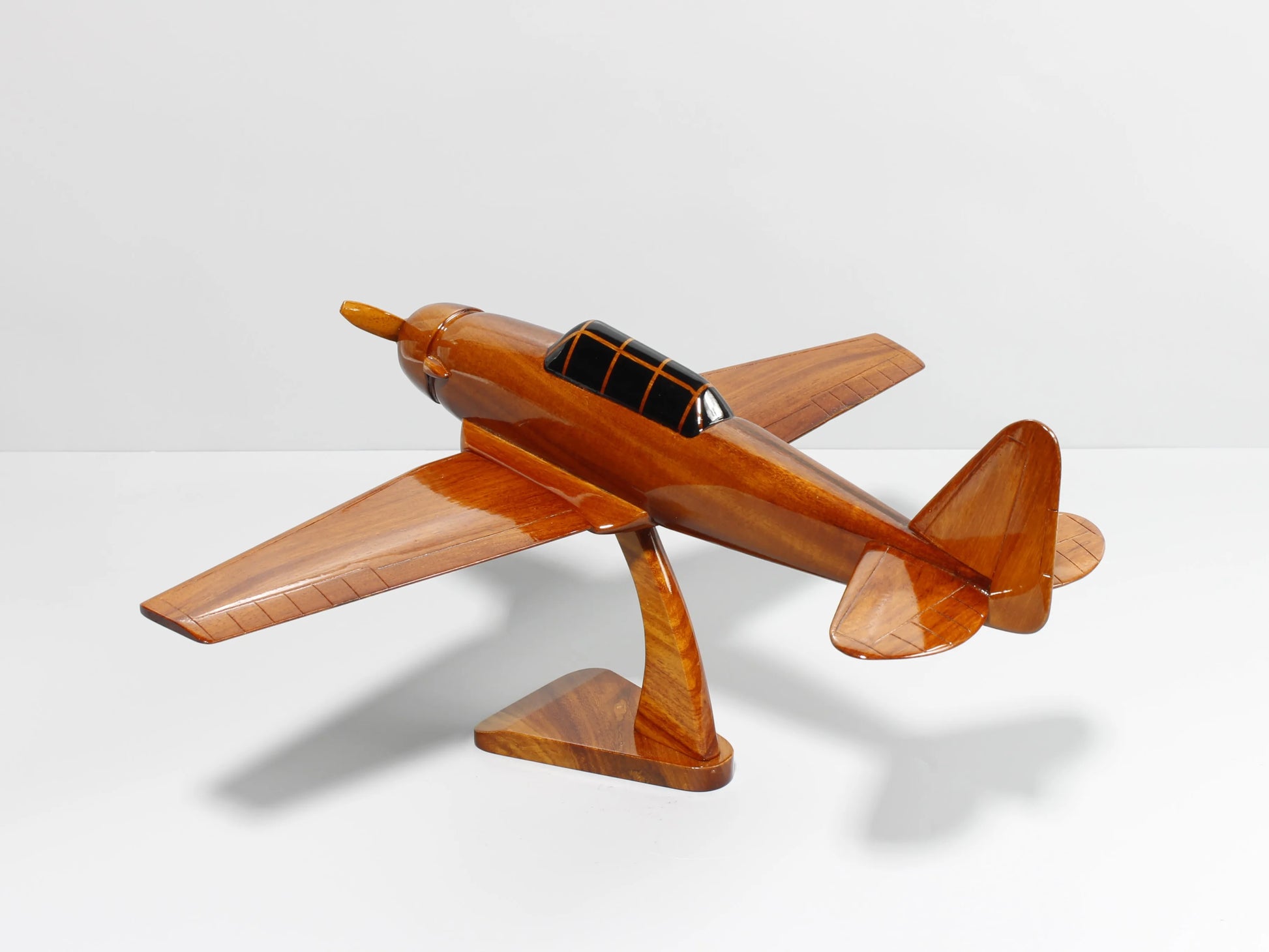 Side angle of handcrafted T-6 Texan wood model showing tail and canopy – Premiumwoodart