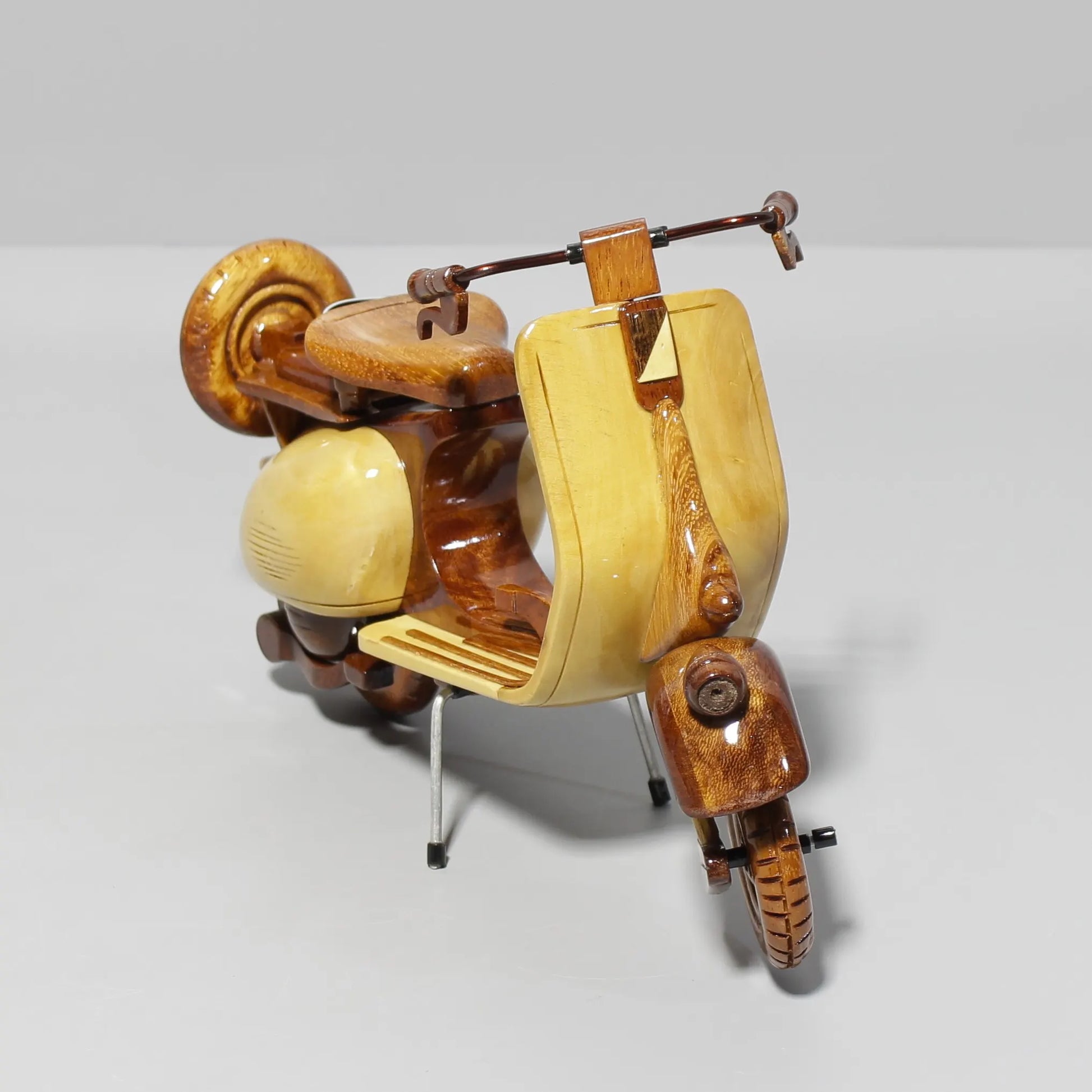 Vintage wooden Vespa scooter model – angled showroom pose