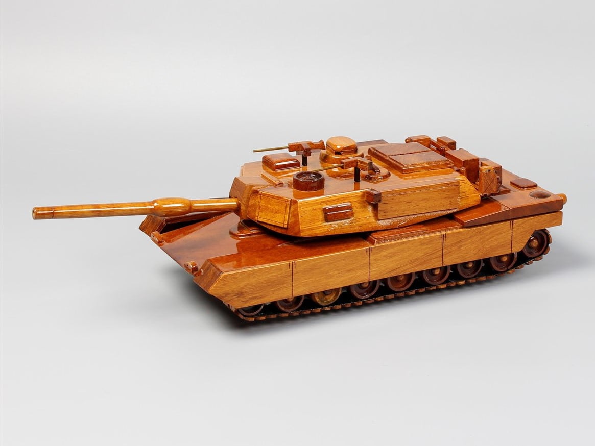 Handcrafted wooden M1 Abrams tank model with realistic turret and natural wood finish
