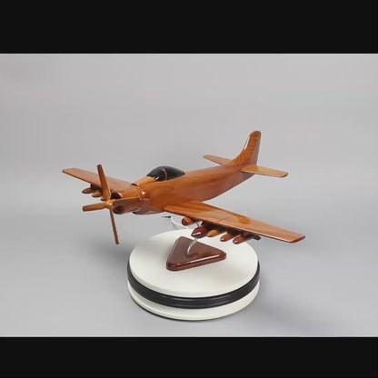 Artisan-crafted wooden Skyraider airplane model, a unique piece of aviation memorabilia, perfect as a gift for pilots and veterans.