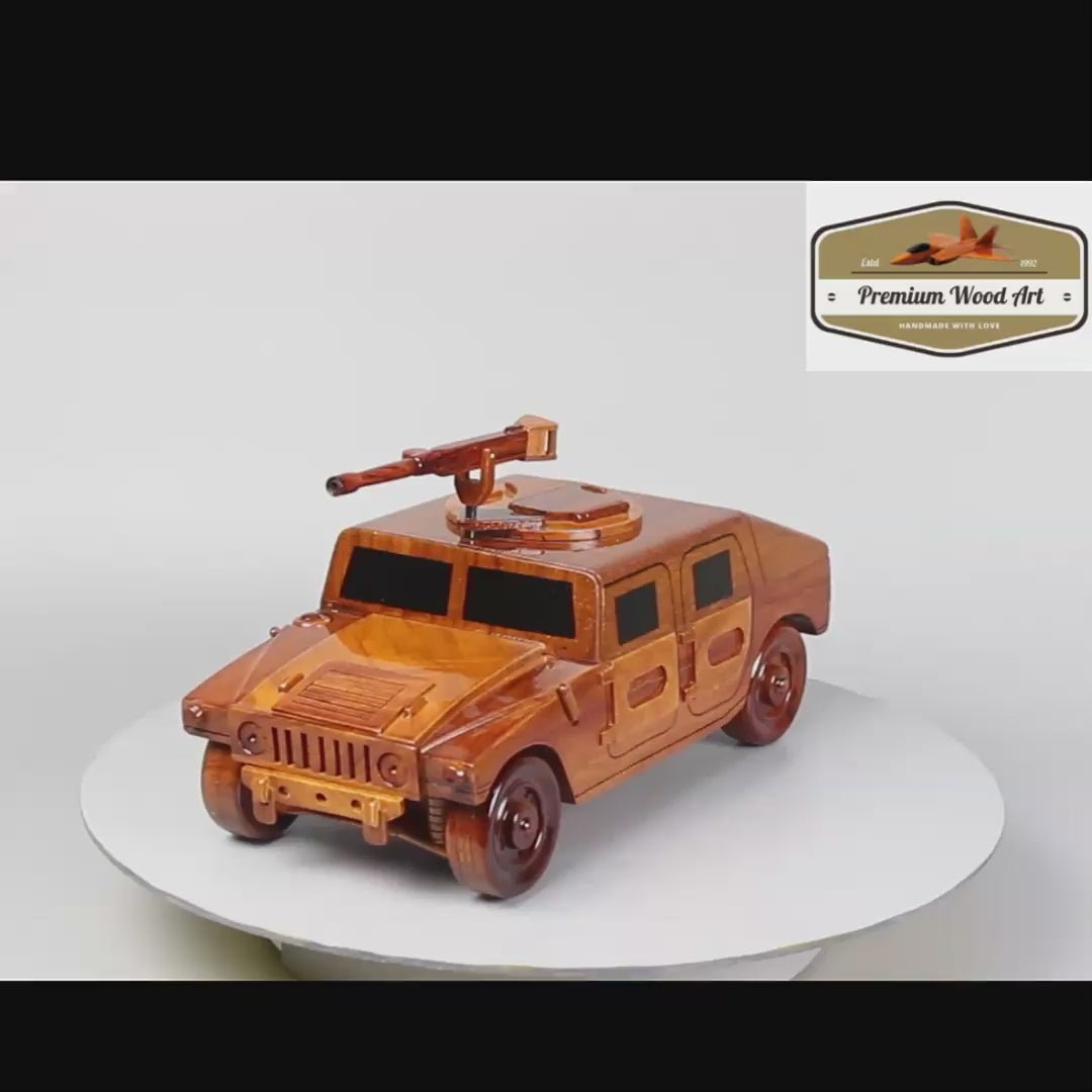 Hand-crafted wooden replica of a military HMMWV, complete with a 50 cal gun, perfect as a gift for veterans or military enthusiasts.