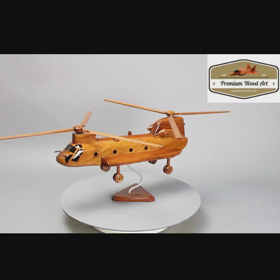 Intricate wooden sculpture of the CH-47 Chinook, celebrating its role in the military history and as a symbol of advanced aviation.