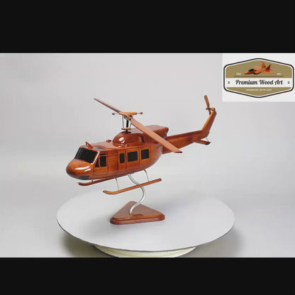 The Bell 212 Twin Huey, a wooden helicopter model reflecting the helicopter's legacy in list of military helicopters.